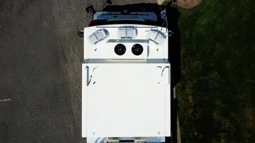 Top-down view showing cab roof, turntable area, and ladder base