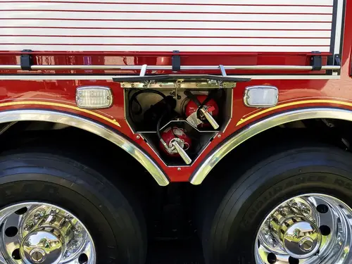 Lower side compartment open with portable equipment and mounted gear