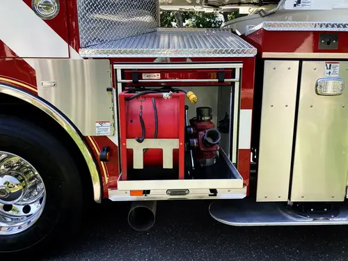 Narrow side compartment close-up showing hydraulic controls and valves