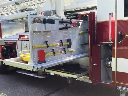 Portable ventilation fan close-up secured inside lower compartment