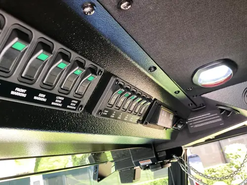 Roll-up door manufacturer plate close-up on body panel