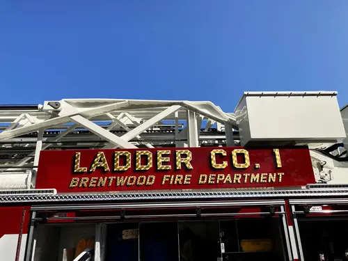 Pierce tower ladder low-angle front view showing bumper and grille