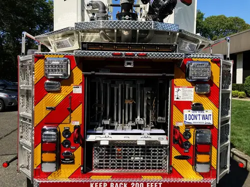 Cab interior wide view showing center console, seats, and mounted equipment