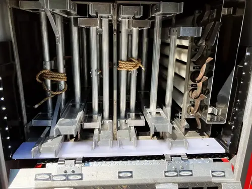 Cab interior view from rear showing control consoles and crew seating