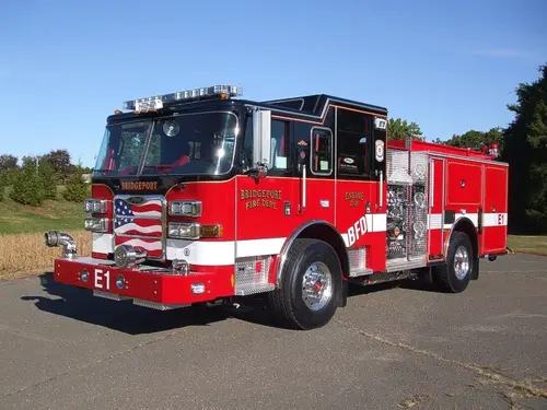 Pumper front-left exterior view showing enclosed cab and side compartments