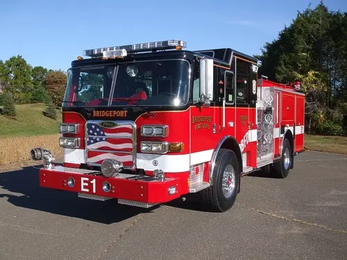 Front-left exterior view showing bumper, cab, and side body