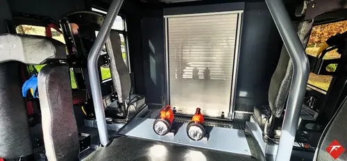 Rear crew area close-up showing seat mounts and side paneling
