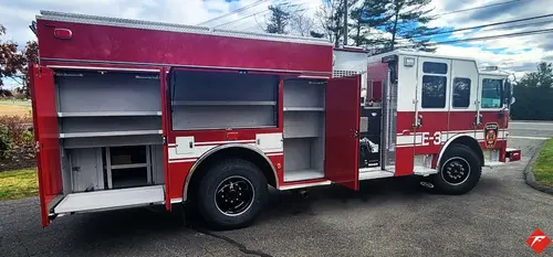 Driver-side profile with compartment doors open showing side storage bays
