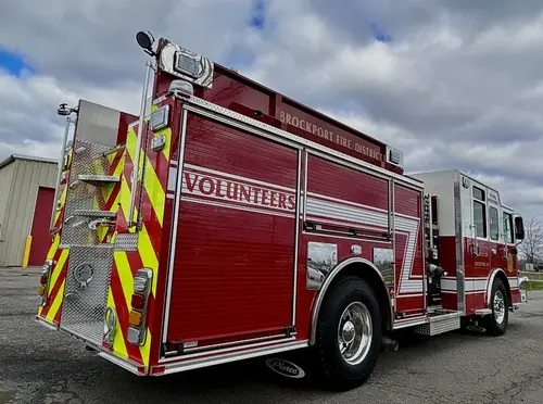 Rear-left exterior view showing side body panel and rear wheel area