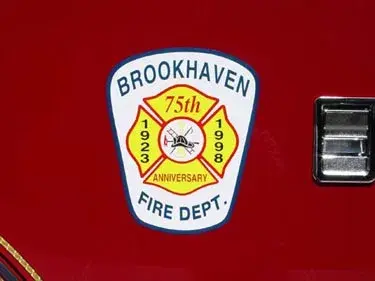 Close-up of shield-style anniversary logo on red side panel