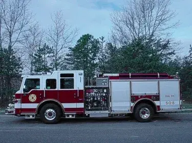 Driver-side profile showing exposed pump panel and side body compartments