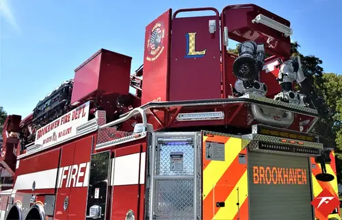 Ladder base close-up showing red upper platform and rear equipment