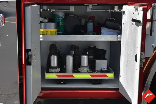 Open side compartment showing utility containers and shelf storage
