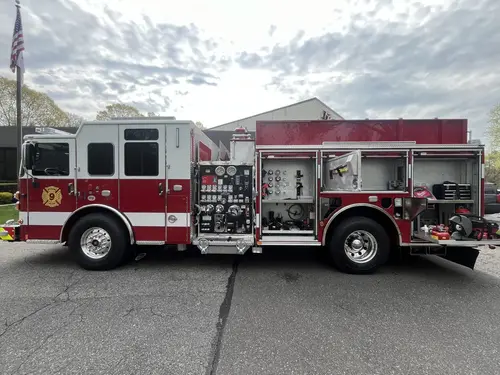Pierce Saber pumper, officer-side profile view showing pump panel and side compartments