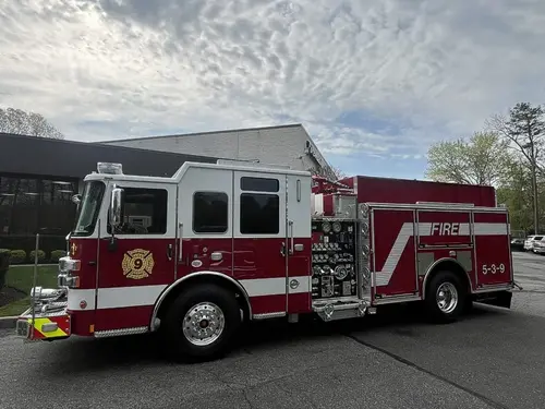 Pierce Saber pumper, front-left view showing pump panel side and cab