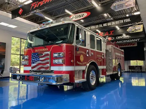 Pumper front-left exterior view showing grille, bumper, and side body