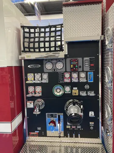 Pump panel close-up showing gauges, valves, and intake controls