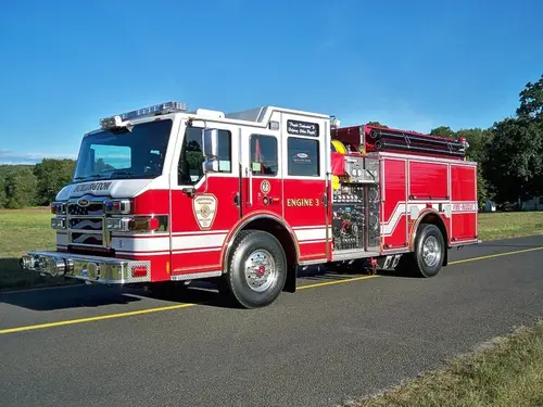 Pumper front-left exterior view showing enclosed cab and side compartments