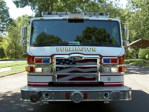 Front exterior view showing grille, bumper, and warning lights