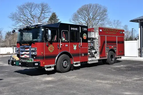 Pumper front-left exterior view showing cab corner, grille, and side body