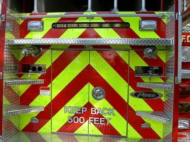 Rear chevron close-up showing lower hose connections and rear warning lights