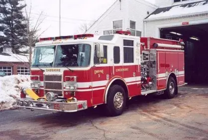 Pumper front-left exterior view showing enclosed cab and side compartments