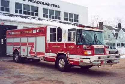 Rescue truck front-left exterior view showing enclosed cab and long body