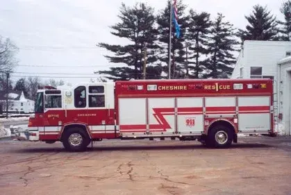 Driver-side profile showing long rescue body compartments and wheel area