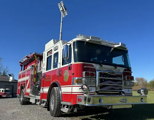 Pierce pumper front-right exterior view with side body and front wheel visible