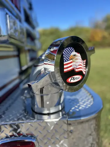 Front bumper intake cap close-up with emblem detail