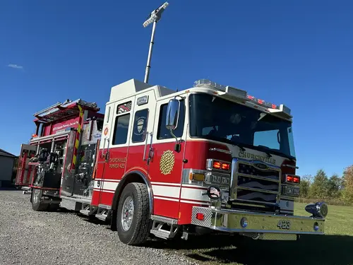 Pierce pumper front-right profile view with grille and side compartments