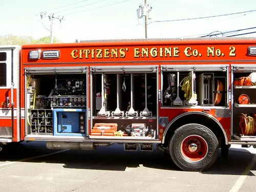 Driver-side profile with open compartments showing full equipment layout