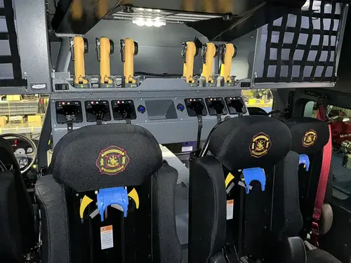 Rear crew interior view showing SCBA seats and mounted radio chargers
