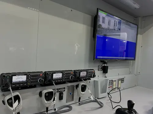 Interior monitor and command desk close-up with outlets below