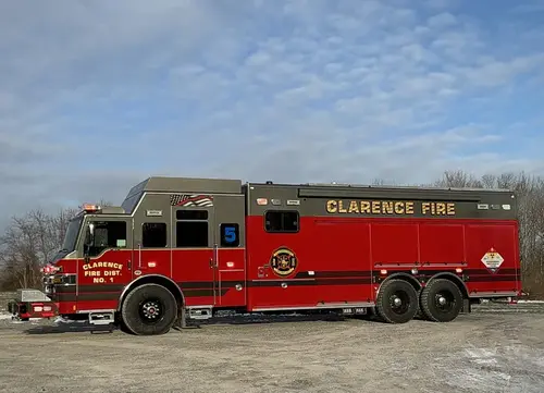 Driver-side profile view showing tiller body and aerial ladder sections