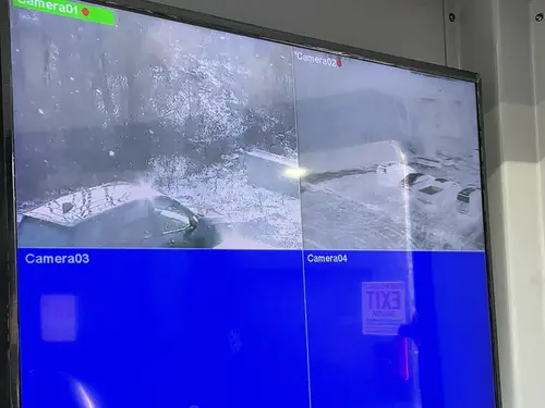Interior monitor display showing blue camera grid screen