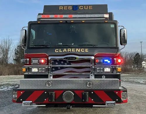 Head-on front view showing grille, bumper intakes, and warning lights