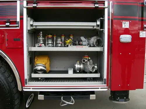 Open side compartment showing shelf bins and tool cases