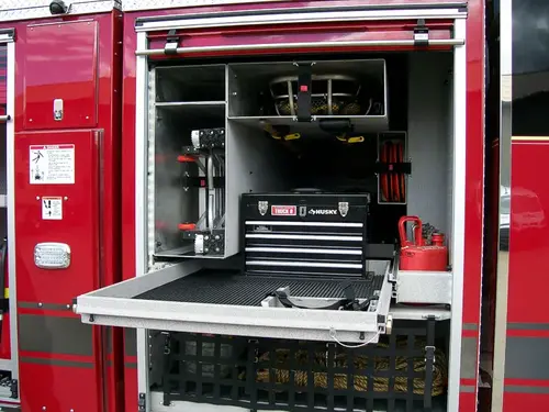 Open side compartment showing pull-out tray with mounted tool chest