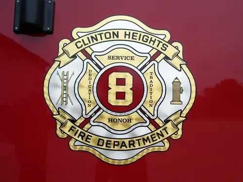 Cab door close-up showing fire department crest badge