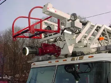Ladder tip and monitor close-up showing nozzle, guard rail, and hardware