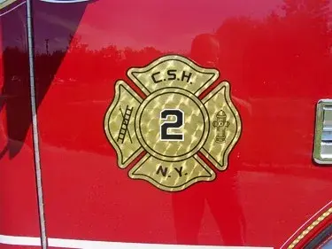 Shield logo close-up on red side panel