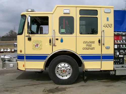 Cab side close-up showing door panel and front wheel area