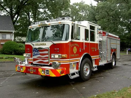 Pumper front-left exterior view showing bumper, cab, and side compartments