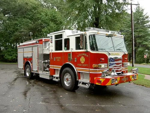 Front-right exterior view showing grille, bumper, and side body