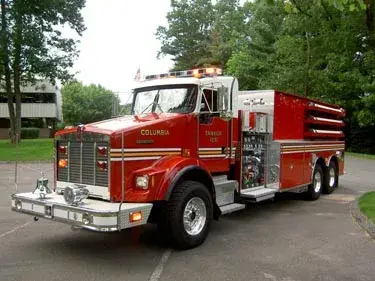 Tanker front-left exterior view showing Kenworth-style cab and long tank body