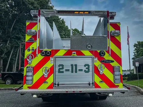 Rear view showing red-and-yellow chevrons and centered rear opening