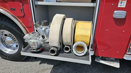 Lower body close-up showing hose reel, wheel area, and side panel