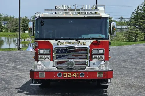 Head-on front view showing grille, bumper, and warning lights
