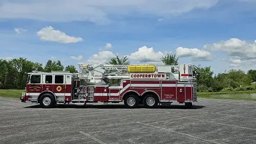 Aerial ladder truck side profile view showing full body and ladder sections